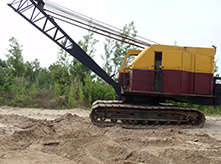 Heavy construction equipment lined up on a job site